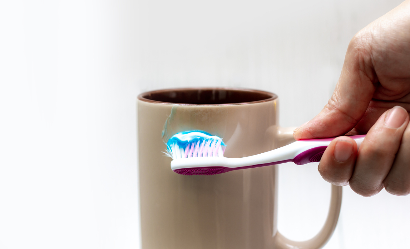 Stock image of brush with toothpaste on it