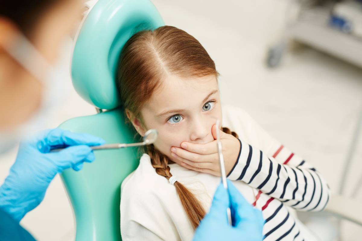 Stock image of a child getting dental anxiety